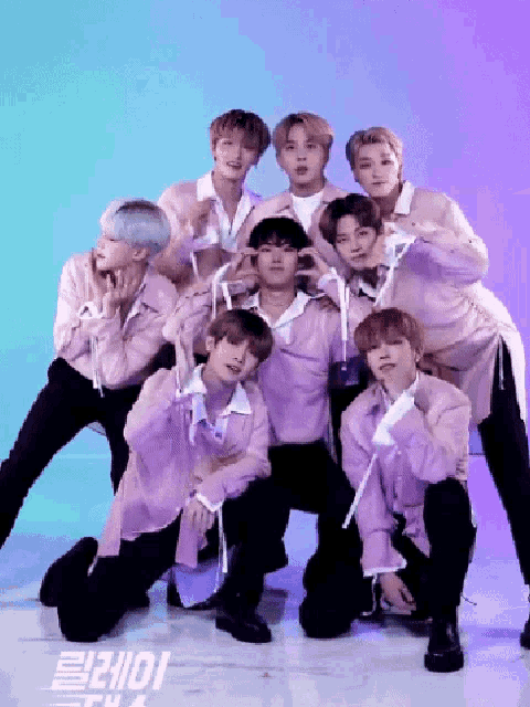 a group of young men posing for a picture with a blue and purple background that says ' iorie '