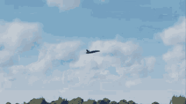 a blue and yellow airplane with the letters us navy on the side of it