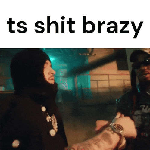 a man in a balaclava talks to another man with the words " ts shit brazy " on the bottom
