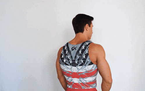 a man is wearing a tank top with an american flag design and the letter k on the back
