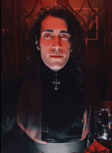a man with red eyes is wearing a crown