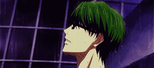 a man with green hair is taking a shower in a shower stall .