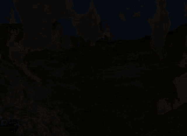 a man and a woman are standing next to each other in front of a mountain