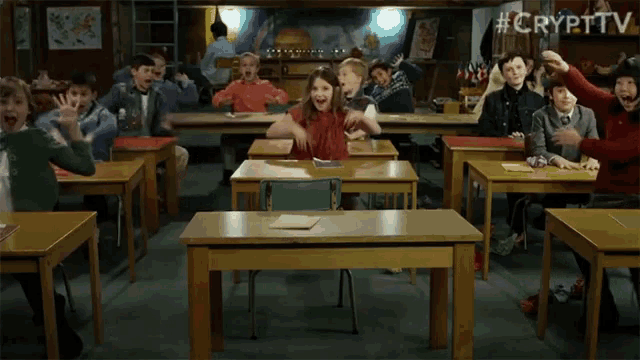 a group of children in a classroom with #crypttv written on the bottom right