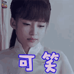 a woman with a ponytail is making a funny face with chinese characters on her face .