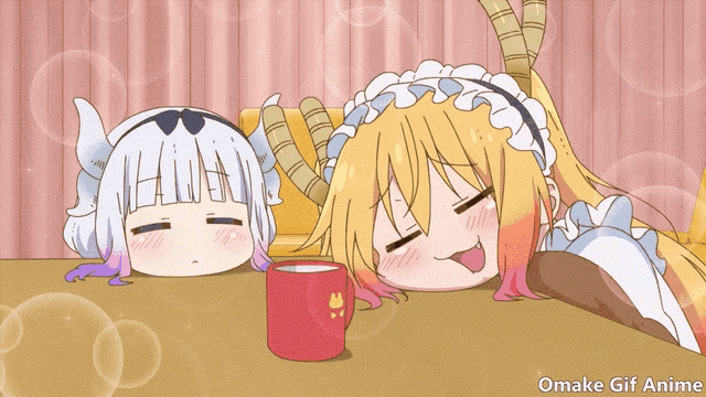 a couple of anime girls laying on a table with a cup of coffee