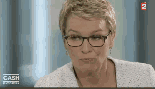 a woman wearing glasses is on a tv show called cash