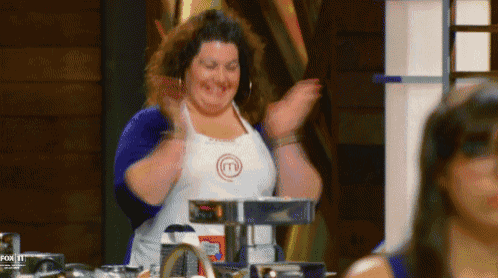 a woman wearing an apron with a m on it