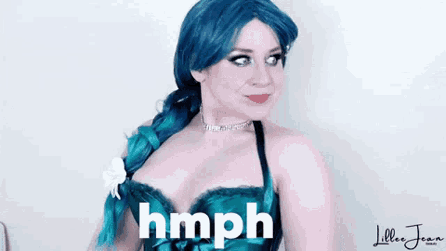 a woman with blue hair is wearing a green corset and has the word hmph written on her chest .