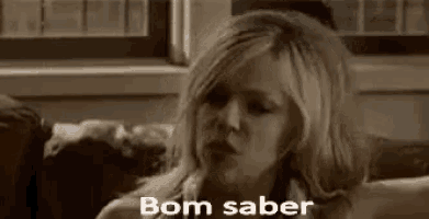 a woman is sitting on a couch with the words bom saber written on it .