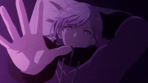 a person with purple hair is reaching out their hand