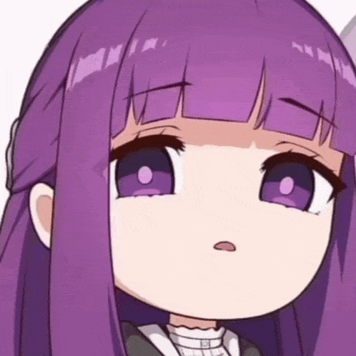 a close up of a girl with purple hair and purple eyes making a funny face .