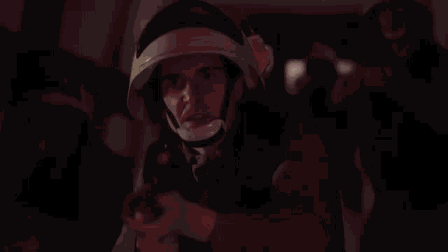 a blurred image of a person in a red light
