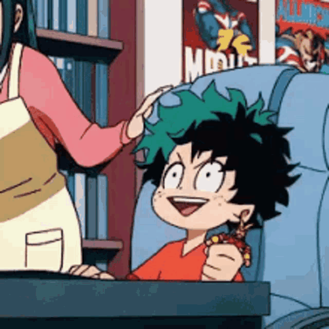 a cartoon character with green hair is sitting in a chair with a woman putting her hand on his head .