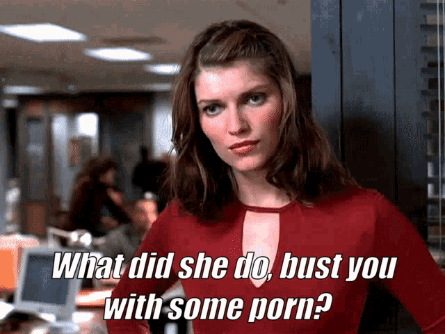 a woman in a red top is standing next to a locker with the words what did she do bust you with some porn