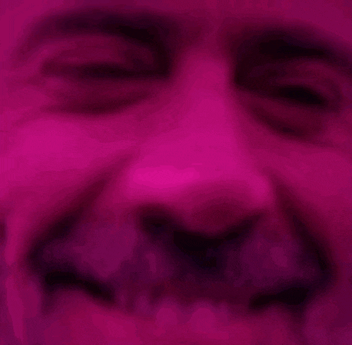 a close up of a person 's face with their eyes closed