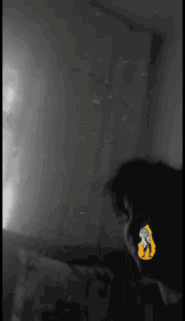 a black and white photo of a person 's face with a yellow sticker on it