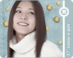 a woman wearing a white turtleneck sweater with the letter b on the bottom