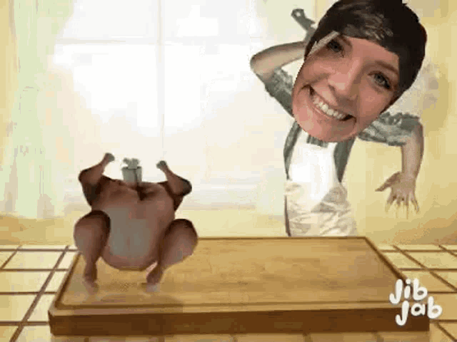 a woman is standing next to a chicken on a cutting board and smiling .