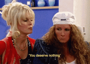 two women are standing next to each other and one of them says you deserve nothing