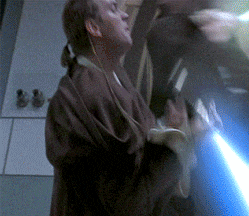 a man in a brown robe is holding a blue lightsaber