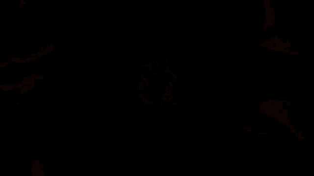 a yellow explosion with a dark background