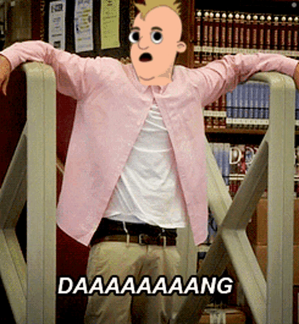 a man in a pink shirt is leaning on a railing with a cartoon face on his face and the words daaaaaang below him