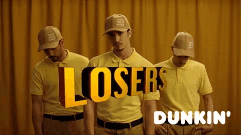 three men wearing yellow shirts and hats with the words losers dunkin ' on the bottom