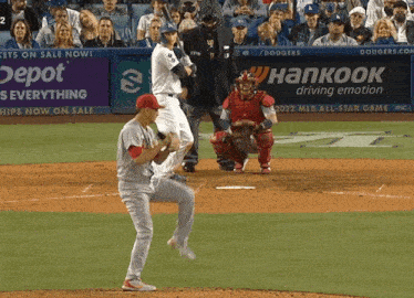 a baseball game is being played in front of a banner for hankook