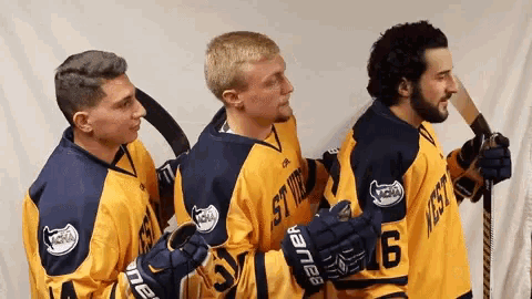 a group of hockey players are posing for a picture and one has the number 6 on his jersey