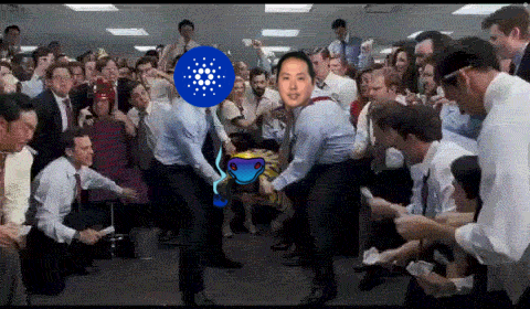 a group of people are dancing in a room with a blue circle with dots on it