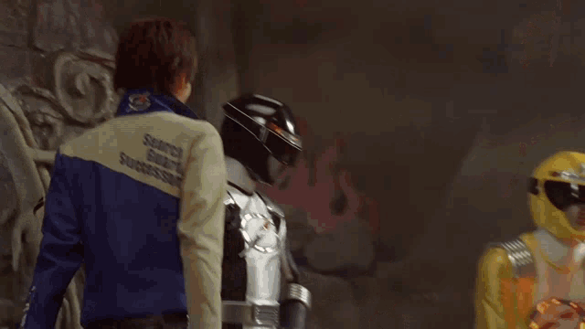 a man wearing a jacket that says search and rescue on it