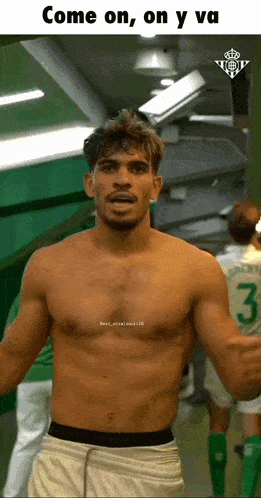 a shirtless man in a locker room with the number 3 on his jersey