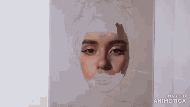 a person is painting a portrait of a woman with a brush .