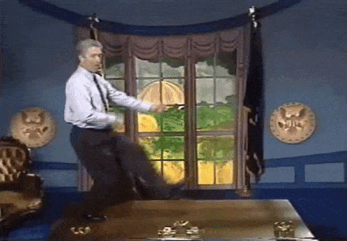 a man is dancing in front of a window in a room