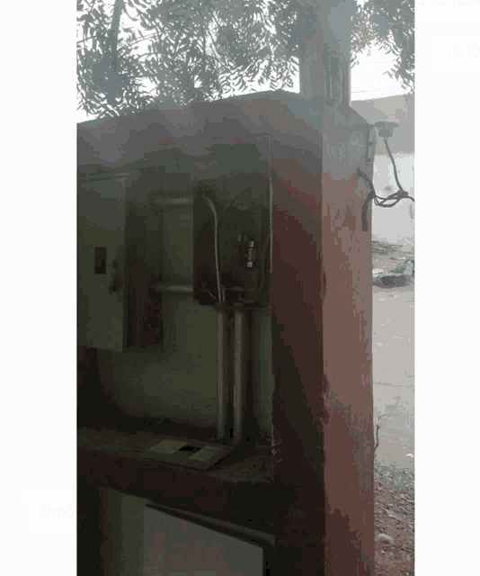 a brick wall with electrical wires coming out of it and a box that says ' electrical ' on it