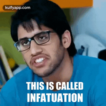 a man wearing glasses and a blue shirt is making a funny face and says this is called infatuation .