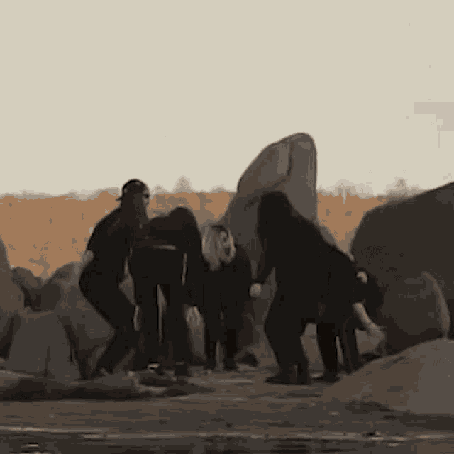 a group of people raising their hands in the air