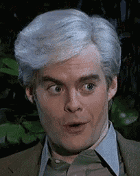 a man with gray hair is making a surprised face .