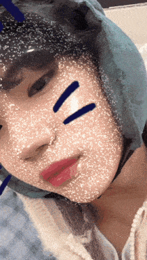 a close up of a person 's face with a mask on