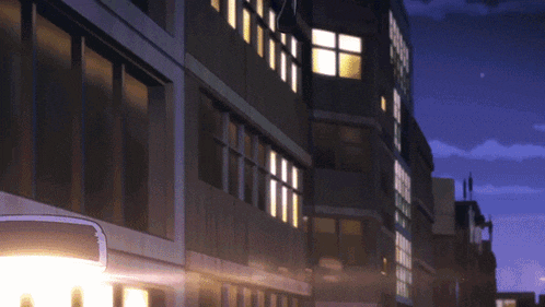 a building with a lot of windows and a street light in front of it