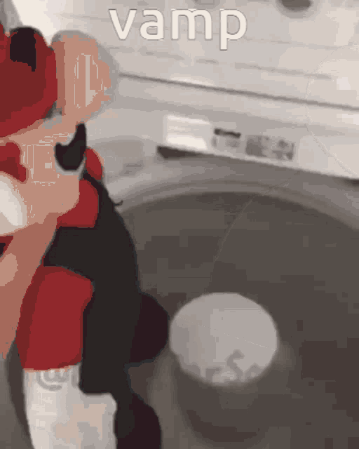 a cartoon character is sitting in a washing machine with the word vamp above him