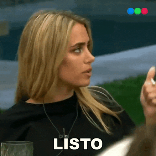 a woman in a black shirt says " listo " in spanish