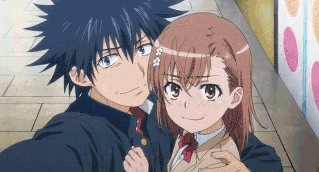 a boy and a girl are posing for a selfie together