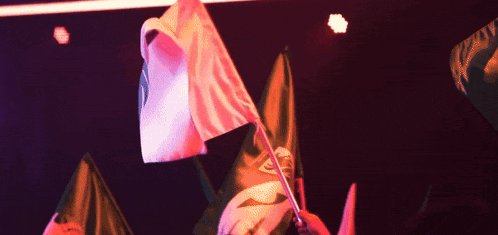 a pink flag with the letter s on it is waving in the wind