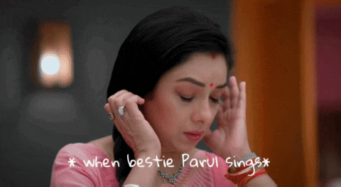 a woman in a pink top has the words when bestie parul sings written above her