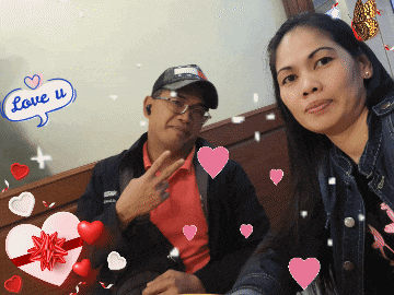 a man and a woman are posing for a photo with a speech bubble that says love u