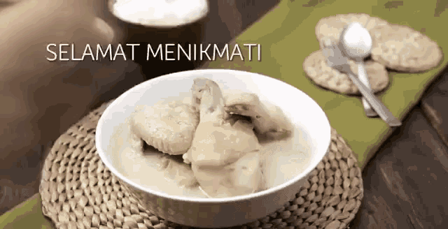 a bowl of chicken soup with selamat menikmati written on the bottom