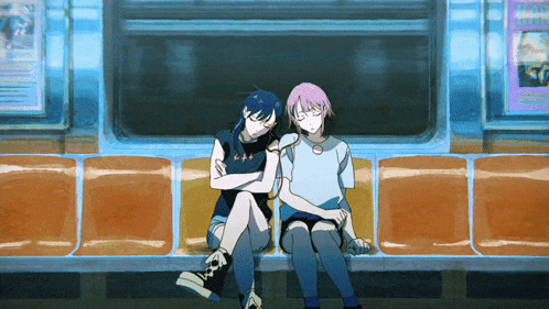 two girls are sitting next to each other on a bus