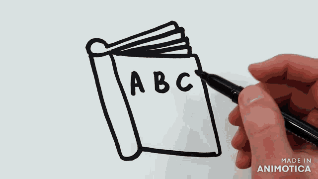 a hand is drawing a book with the letters a and b on it